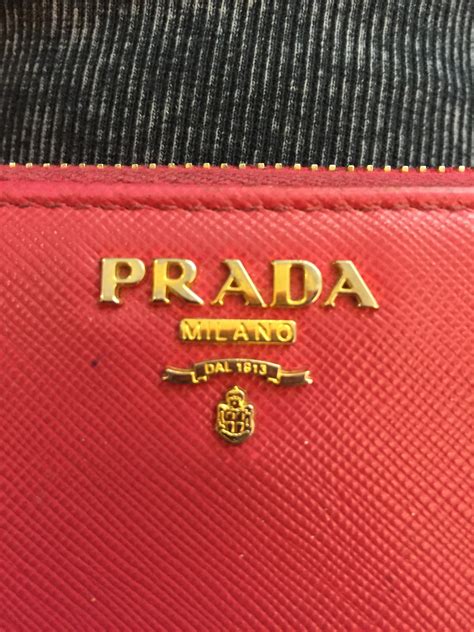 how do you spot a fake prada etiquette wallet